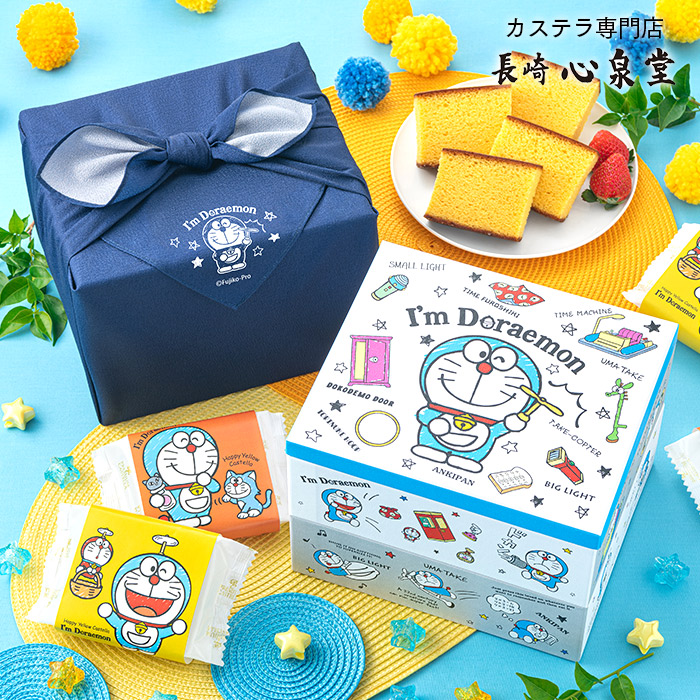 当店限定&starf;ドラえもんデザインの箱＆風呂敷包み ●内容:幸せの黄色いカステラ個包装16個 ドラえもん2段重箱セット ●外寸目安：個包装1個 8.0×13.5×2.5cm(38g) ●